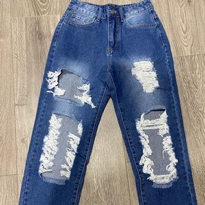 Medium wash high rise ripped jeans
